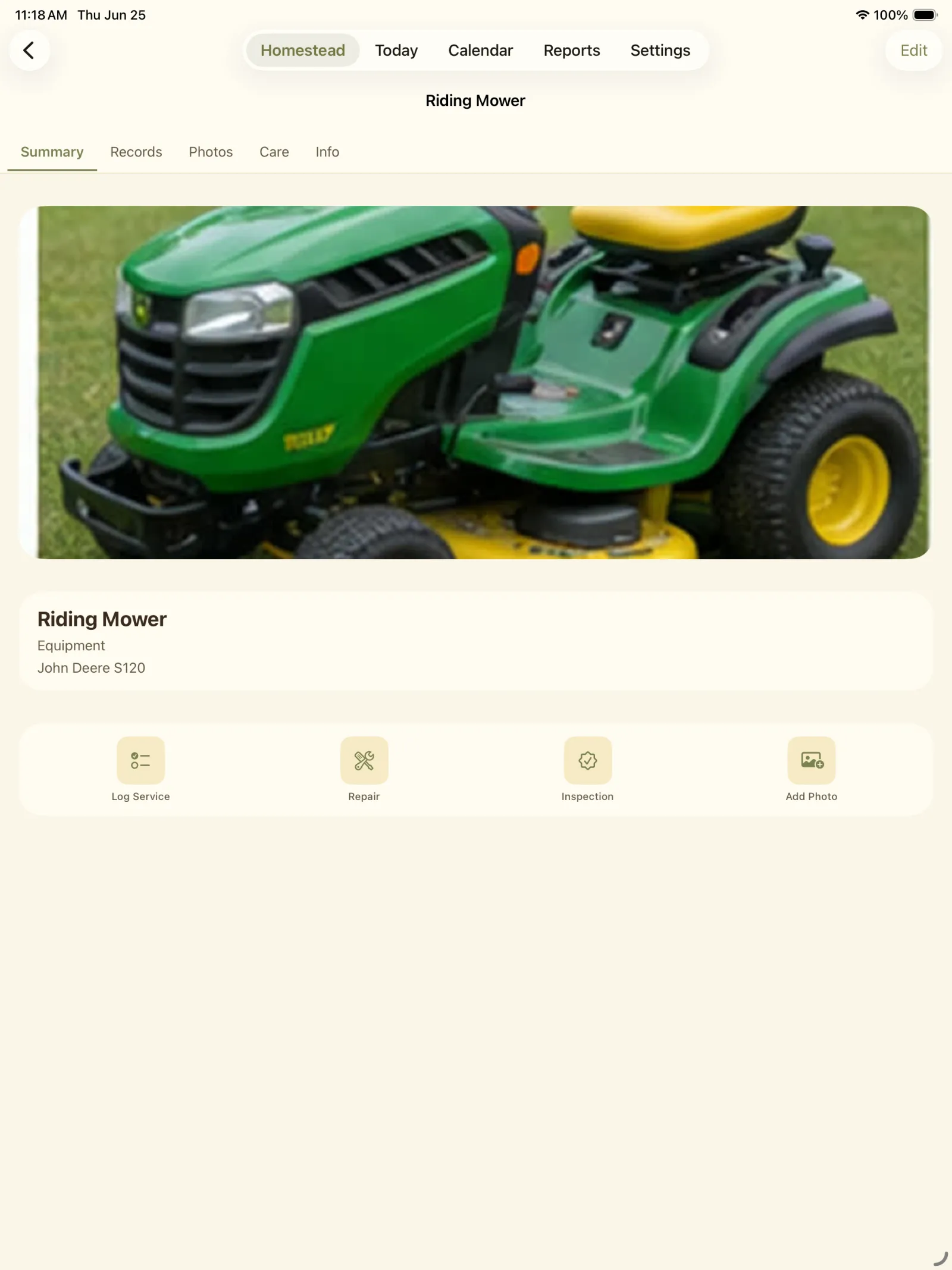 Riding mower detail screen with photo and action buttons.